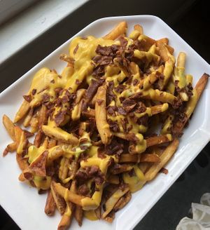 Cajun fries with root cheese and housemade bacon 😛 at Arles and Boggs  in Wallingford