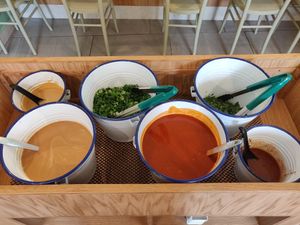 Dipping sauces and herbs at Shuang Shuang in London