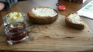 Hot X bun with jam and vg spread at The Greenhouse in Horsforth