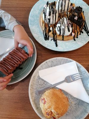Chocolate cake, chocolate waffles and a scone with butter and jam at The Greenhouse in Horsforth