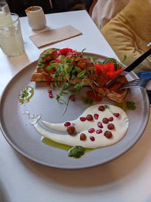 Savoury Waffle with edible flowers! at Sacred Grounds in Exeter
