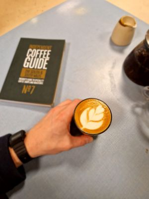 Flat white and breakfast tea  at Sacred Grounds in Exeter