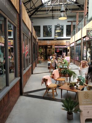 Outside tables in the alley at Sacred Grounds in Exeter