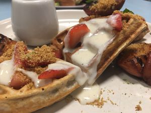 Sweet waffles August 19 - roasted peaches, macerated strawberries, creme anglaise at Sacred Grounds in Exeter