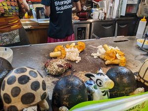 Mushrooms and okonomiyaki being prepared at Yasai Izakaya Genki in Tokyo