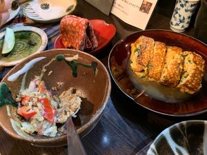 Potato salad and omelette dishes at Yasai Izakaya Genki in Tokyo