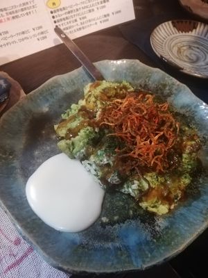 Okonomiyaki with avocado in it and carrots on the top at Yasai Izakaya Genki in Tokyo
