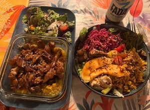 2 main dishes. On the left: seitan cooked yakitori style on top of a yam purée and grean peas! On the right: buddha bowl with rice, hummus, lettuce, broccolini etc! So good!  at La Cabane en Ville in Aix-en-provence