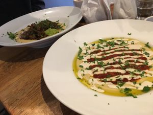 Hamshuka (foreground) and Hummus Tajine  at Café Mugrabi in Berlin
