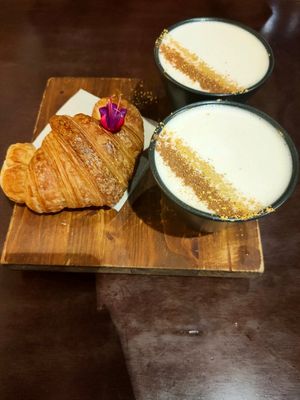 Chay latte with coconut and oat, vegan croissant at La Fabrica in Girona