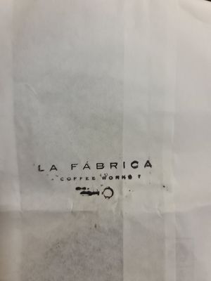 Cookie in branded paper bag at La Fabrica in Girona
