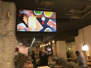 Interior with tofu sandwich on screen  at Nibble in Girona