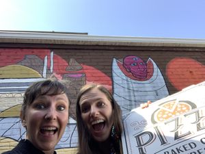 Delicious pizza and cool mural in the back!! at Pizza Pronto Oakland in Pittsburgh