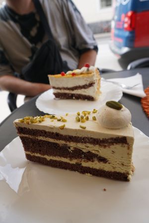 vegane Pistazientorte, hinten vegane Maracuja Sahne Torte at Café Maria Theresia in Merano