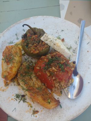 Gemista (stuffed tomato and stuffed pepper, served with some thickly cut fried potatoes and slices of vegan feta! (Probably Violife)  at Karma in Santorini
