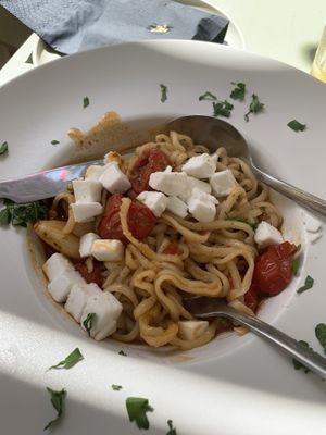 Homemade pasta with local tomatoes and vegan feta  at Karma in Santorini