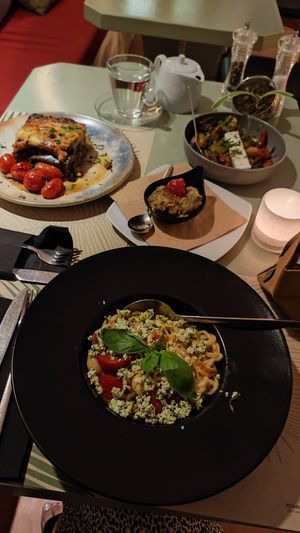 vegan feta pasta, in the background you can see aubergine dip and vegetable sufiko (the side dish version, not main) at Karma in Santorini