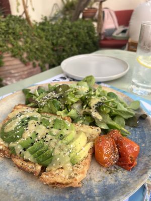 “Speak the truth” avocado toast and salad  at Karma in Santorini