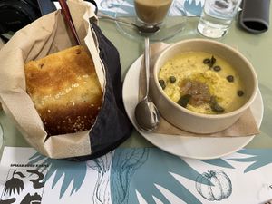 Fava with caramelised onions homemade Greek sundried tomato bread  at Karma in Santorini