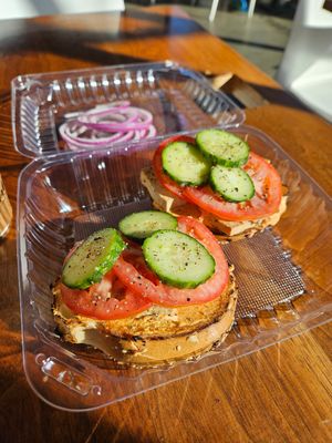 Spicy vegan bagel with baked tofu added at Influx Cafe - Little Italy in San Diego