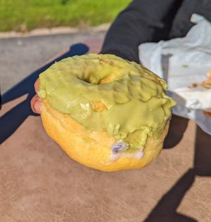 Green Tea donut..this photo doesn't do justice.. got a little damaged in transit. at Vegan Bistro in San Jose