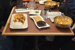 Tofu rice, kimchi noodles, spring rolls, and seaweed salad at Kimchi House in Jasper