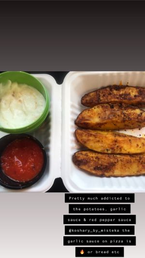 The beautiful potato wedges, garlic sauce & red pepper sauce at Koshary Corner in Clarksville