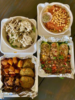 Clockwise from upper left: falafel salad, koshary bowl, zucchini boats, falafel platter at Koshary Corner in Clarksville