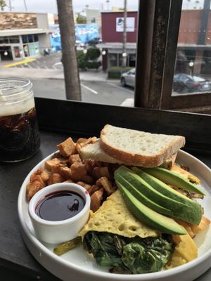 Harvest omelette with sour dough and like 500 potatoes. Oh, and cold brew coffee 🧡  at Breakfast Republic - Ocean Beach in San Diego