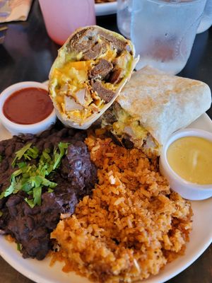 Vegan breakfast burrito with a side of vegan hollandaise sauce at Breakfast Republic in Encinitas