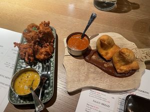 Onion pakora on left, samosa on right.  at Indie Indian Kitchen in Tromsoe