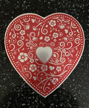 Vegan Silver Embossed Heart - 29 pc (16 oz). Includes includes soft creams, crunchy hazelnut selections, brasero and hazelnut ganaches, marzipan, cordial cherries, & more. at Rose City Chocolatier in Martinsburg