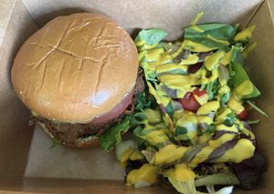 The Lion’s Main Unchick sandwich and side sakad in a “to go” box. Messy to eat but absolutely delicious!  at Beyond Vegan Cell Food in Portsmouth