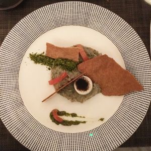 Smokey aubergine, flatbread, and harissa with ages garlic and spiced pistachio  at Vanilla Black in London