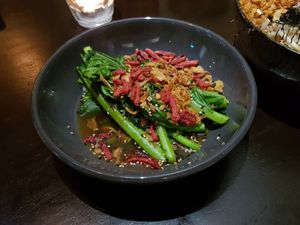 Asian greens topped with fried onions and beetroot at I Like Ramen in Fortitude Valley