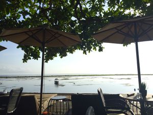 Outdoor seating at Kayumanis Seaside in Sanur
