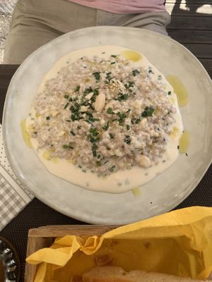 Fresh made cheese and nuts risotto  at Verde Vegan in Livorno