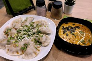 Hand-made dumplings stuffed with lentil and cranberry. Pumpkin soup. at Vegan Heaven in Lublin