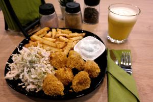 Roasted cauliflower nuggets with roasted French fries and salad from Chinese cabbage. Freshly squeezed apples juice.
 at Vegan Heaven in Lublin