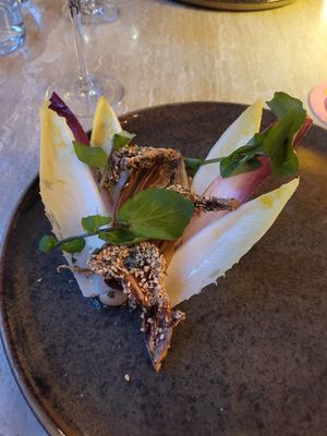 Intermediate

Fried oyster mushroom rolled in nori, fennel seed, and sesame – oyster mushroom puree with roasted yeast – chicory cooked in Marmite butter – watercress –
raw at Bonboon in Amsterdam