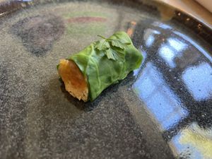 Amuse with tofu ricotta and celeriac in spinach leaf. at Bonboon in Amsterdam