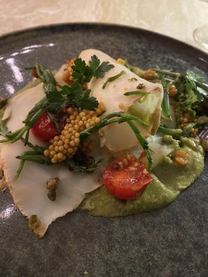Smoked celeriac, blistered tomatoes, pickled mustard seeds, samphire and more  at Bonboon in Amsterdam
