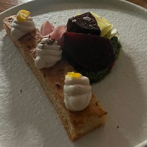 Focaccia met cashew crème, gerookte en ingelegde bietjes, cashew pesto  at Bonboon in Amsterdam