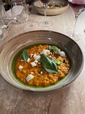 Smoked tomato risotto, crunchy garlic, pickled fennel, pine nuts, basil, tarragon and basil oil  at Bonboon in Amsterdam