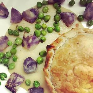 Portobello pie, white bean sauce, mint peas and truffle patatoes at Bonboon in Amsterdam