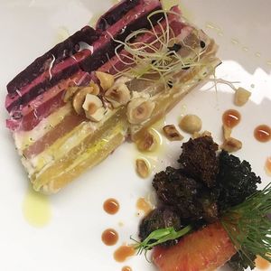 Puffed beet, cashew cream, roasted hazelnuts and baby kale. at Bonboon in Amsterdam