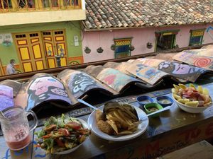 Falafel burger with salad and the fruit bowl  at Namaste Vegan Food in Guatape