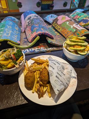 Falafel pita comes with fries and two big salads! at Namaste Vegan Food in Guatape