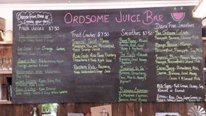 Menu board detailing juices and smoothies at Kimberley Cafe in Kununurra