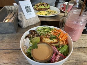 Scrambled eggs in background are not vegan!! But I had a Thai salad and he had an avocado toast (vegan) with eggs (not vegan)  at The Urban Garden in Vilnius